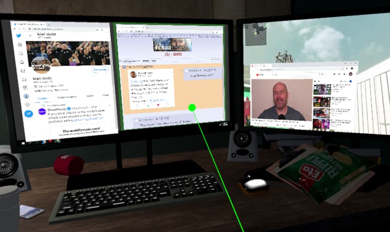 A desk with two screens displaying YouTube videos, a video game, Twitter and 4Chan messages — an interaction pointer is selecting the 4Chan message posts.